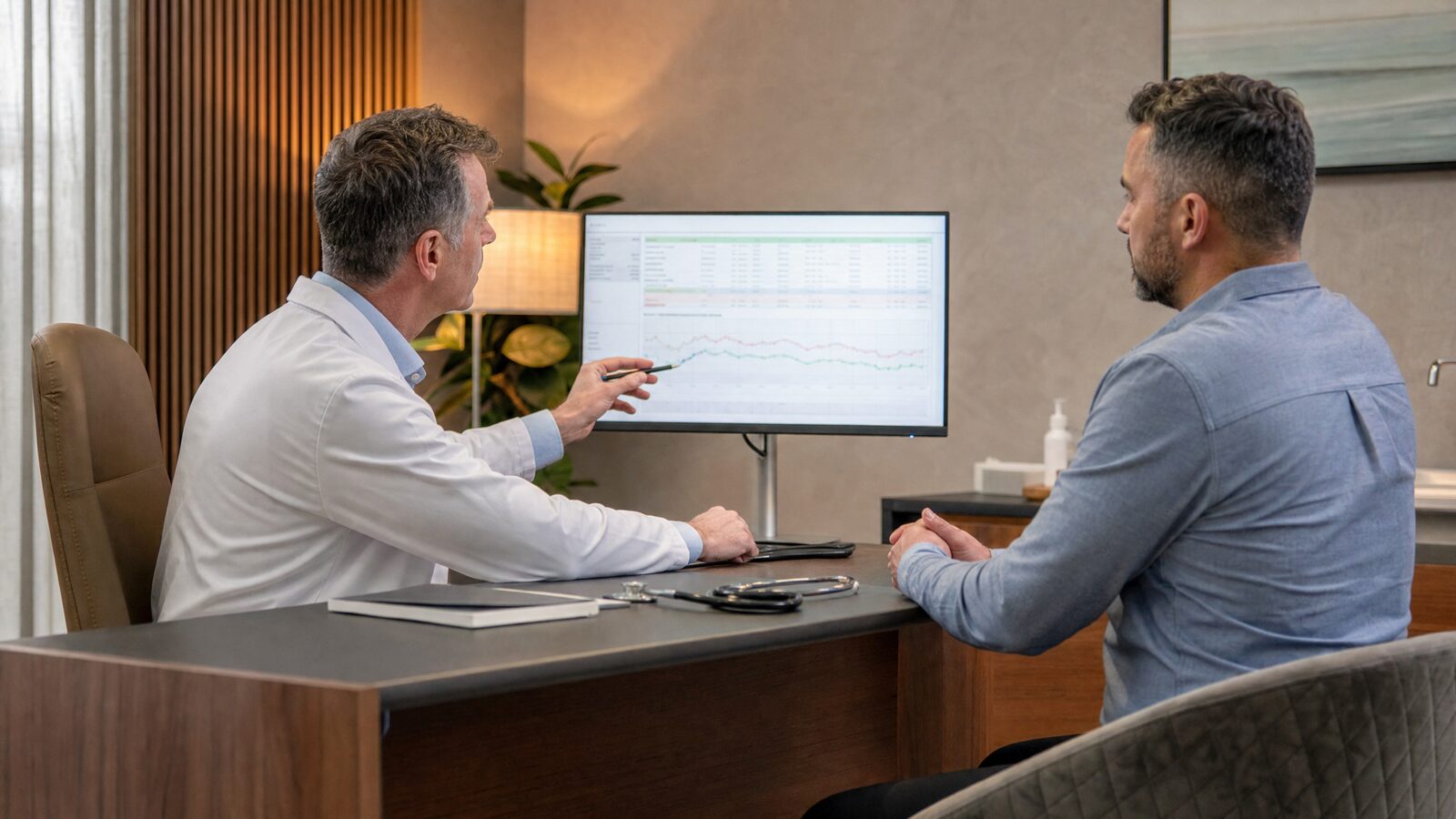 A male patient consulting with a doctor about testosterone replacement therapy at a modern Irish clinic